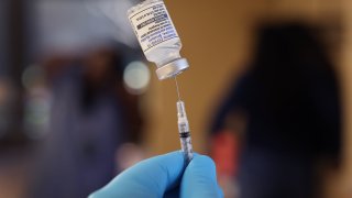 A pharmacist prepares to administer Covid-19 vaccine booster shots during an event hosted by the Chicago Department of Public Health at the Southwest Senior Center in Chicago, Illinois, Sept. 9, 2022.