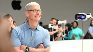 Apple CEO Tim Cook next to Apple’s new Vision Pro virtual reality headset, at the Apple Park campus in Cupertino, California, on June 5, 2023.