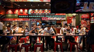 People dine out at a restaurant in Beijing on May 26, 2023.