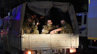 Members of the Wagner Group prepare to depart from the Southern Military District’s headquarters and return to their base on June 24, 2023 in Rostov-on-Don, Russia.