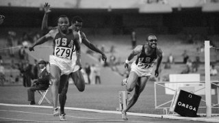 Jim Hines of the USA (left, number 279) wins the 1968 Mexico Olympics 100-meter final.