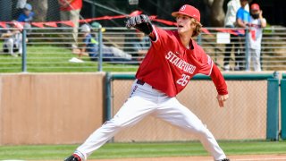 Stanford pitcher Quinn Mathews (26) winds up for a pitch during the game between the Arizona State Sun Devils and the Stanford Cardinal on Sunday, April 10, 2022 at Klein Field in Palo Alto, California.