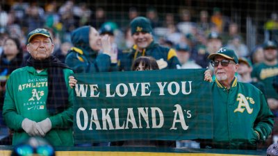 A's investigating why 'SELL' T-shirt fans were removed from suites