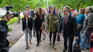 Youth plaintiffs are greeted by supporters as they arrive for the nation’s first youth climate change trial at Montana’s First Judicial District Court on June 12, 2023 in Helena, Montana.