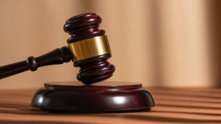 Judge gavel on a homogeneous background Justice and injustice, law