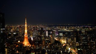 The Tokyo Tower, left, and commercial and residential buildings at night in Minato district of Tokyo, Japan, on Saturday, Oct. 1, 2022. Photographer: Akio Kon/Bloomberg via Getty Images