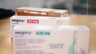 Packages of the weight-loss drug Wegovy from the pharmaceutical company Novo Nordisk lie on the sales counter in a Danish pharmacy.
