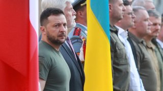 Czech President Petr Pavel (2nd L) and Ukrainian President Volodymyr Zelensky (L) review a military honor guard in front of the Prague Castle in Prague, Czech Republic, on July 6, 2023.