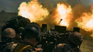 FILE – Ukrainian soldiers fire a cannon near Bakhmut, an eastern city where fierce battles against Russian forces have been taking place, in the Donetsk region, Ukraine, May 15, 2023.