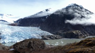 Chunks of ice float in Mendenhall Lake in front of the Mendenhall Glacier on April 29, 2023, in Juneau, Alaska.