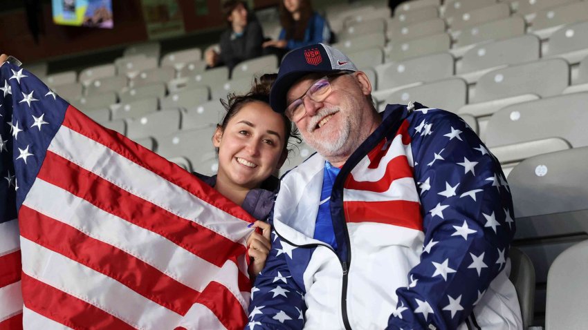 David Tritz, from Laguna Hills, California, and his daughter Erin Tritz, pose for a photo after taking their seats at the Women’s World Cup soccer match between New Zealand and Norway in Auckland, New Zealand, on Thursday, July 20, 2023.