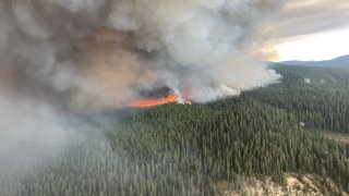 An aerial view of wildfire of Tatkin Lake in British Columbia, Canada on July 10, 2023.