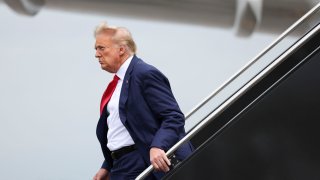 Former President Donald Trump arrives at Ronald Reagan Washington National Airport in Arlington, Virginia, Aug. 3, 2023.
