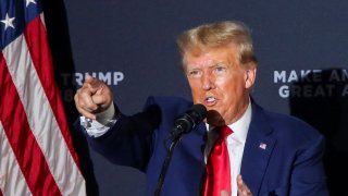 Former U.S. President and Republican presidential candidate Donald Trump speaks on the stage during a campaign rally in Windham, New Hampshire, August 8, 2023.