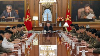 In this undated photo provided by the North Korean government, North Korean leader Kim Jong Un, center, attends a meeting of the North Korean ruling Workers’ Party’s central military commission in Pyongyang, North Korea Wednesday, Aug. 9, 2023.