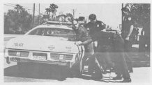 A photo of Hal Barton being arrested at an abortion protest printed in one of the community's newsletters