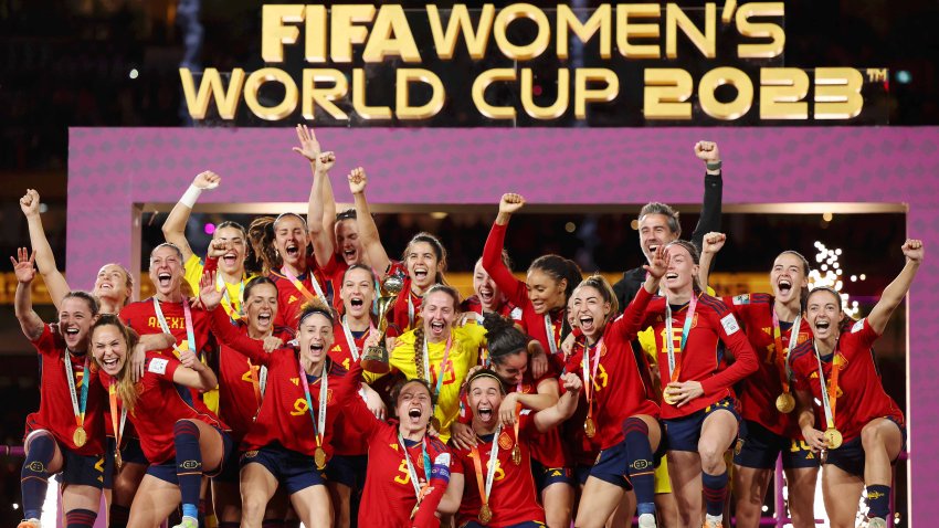 SYDNEY, AUSTRALIA – AUGUST 20: Ivana Andres of Spain and teammates celebrate with the FIFA Women’s World Cup Trophy following victory in the FIFA Women’s World Cup Australia & New Zealand 2023 Final match between Spain and England at Stadium Australia on August 20, 2023 in Sydney / Gadigal, Australia. (Photo by Maddie Meyer – FIFA/FIFA via Getty Images)