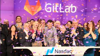 People celebrate the GitLab initial public offering at the Nasdaq, Oct. 14, 2021.