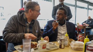 After a months-long public campaign that began shortly after Mayor Brandon Johnson (right) took office in May, advocates reached a deal with restaurant industry lobbyists to phase out the tipped-minimum wage over five years.