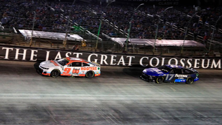 Chase Elliott (No. 9 Hendrick Motorsports Hooter’s Chevrolet) races with Chris Buescher (No. 17 RFK Racing Fastenal Ford) during the running of the NASCAR Cup Series Playoff Bass Pro Shops Night Race on Sept. 17, 2022 at Bristol Motor Speedway in Bristol, Tenn.