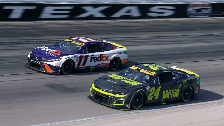 Denny Hamlin, driver of the No. 11 FedEx Office Toyota, and William Byron, driver of the No. 24 RaptorTough.com Chevrolet, race during the NASCAR Cup Series Autotrader EchoPark Automotive 500 at Texas Motor Speedway on Sept. 25, 2022 in Fort Worth, Texas.