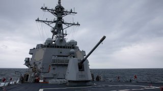 The Arleigh Burke-class guided-missile destroyer USS Ralph Johnson (DDG 114) conducts routine underway operations in the Taiwan Strait