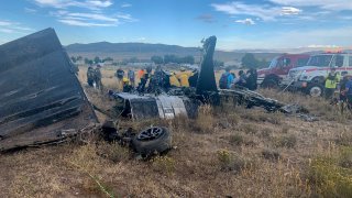 aircraft wreckage, Sunday, Sept. 17, 2023, in Reno, Nev., after two California pilots were killed when their planes collided in mid-air while preparing to land after completing a race at the National Championship Air Races north of Reno.