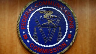 FILE - The seal of the Federal Communications Commission (FCC) is seen before an FCC meeting to vote on net neutrality, Dec. 14, 2017, in Washington.