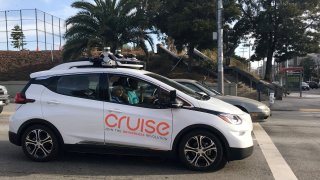 A Cruise self-driving car, which is owned by General Motors Corp, is seen outside the company’s headquarters in San Francisco.