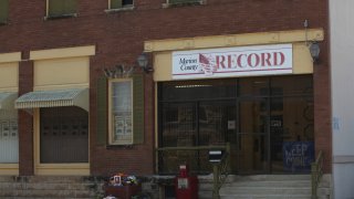 FILE – The offices of the Marion County Record weekly newspaper sit across the street from the Marion County, Kan., Courthouse, Aug. 21, 2023, in Marion.