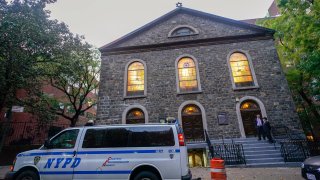 An NYPD patrol car is parked outside a synagogue on the Lower East Side of Manhattan