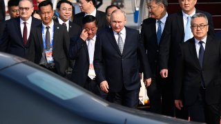 Russia's President Vladimir Putin, center, arrives at Beijing Capital International Airport