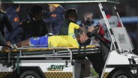 Neymar leaves Brazil match in tears with left knee injury; team doctor says severity unknown