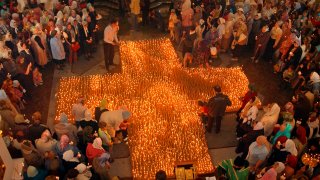 FILE – People light candles during an anti-abortion service in an Orthodox church in Vladivostok, in Russia’s Far East, on May 31, 2007.  In the span of three decades, Russia went from having some of the world’s least-restrictive abortion laws to being what officials call a bulwark of “traditional values,” with the health minister condemning women for prioritizing careers over childbearing.