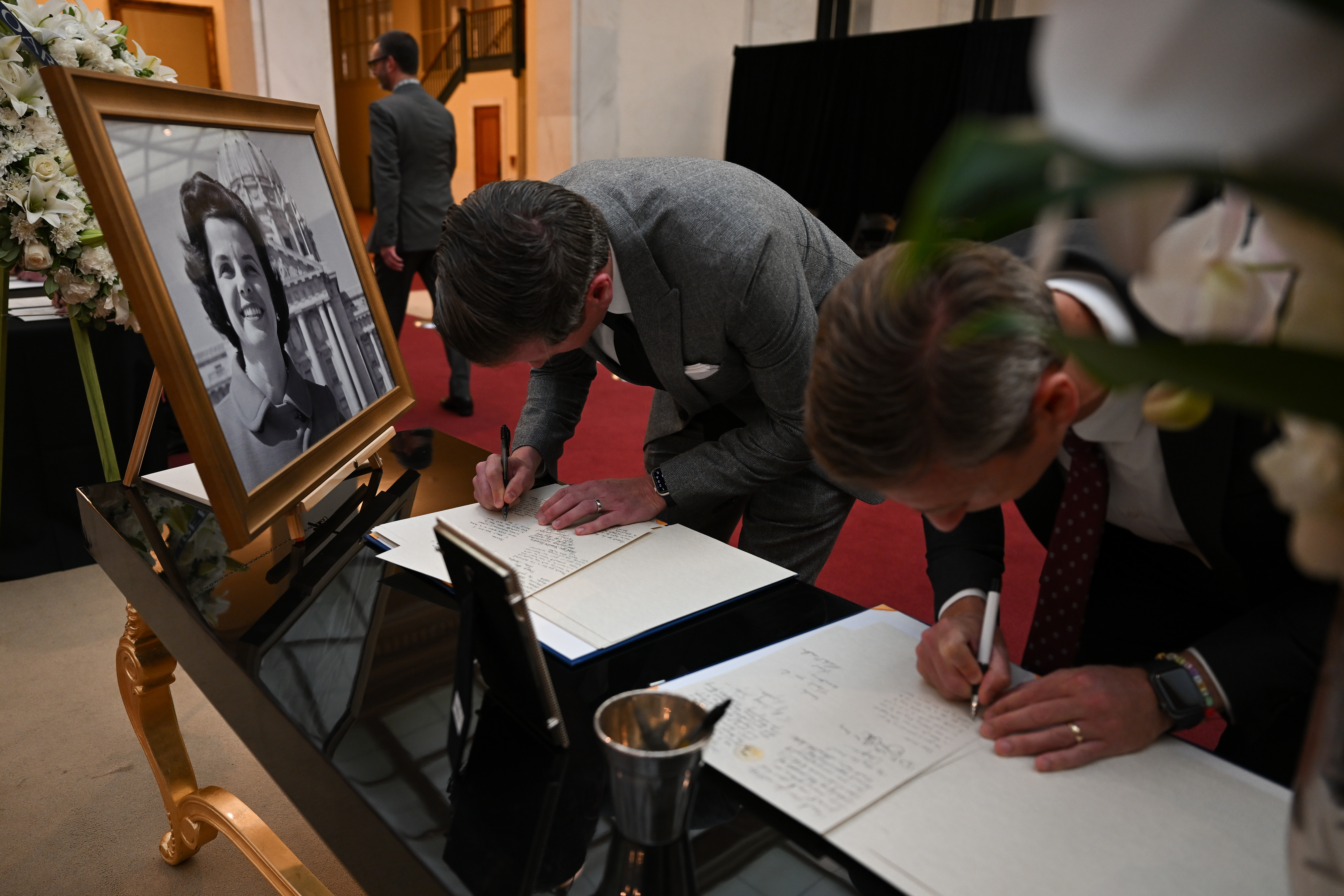 People write in memory of the late Senator Dianne Feinstein, who dies at age of 90 following the long-running health woes, as they attend the funeral ceremony at San Francisco City Hall in San Francisco, California, United States on October 04, 2023. (Photo by Tayfun Coskun/Anadolu Agency via Getty Images)