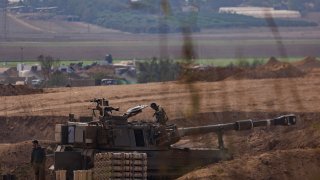 Israeli tanks and troops near the border with Gaza