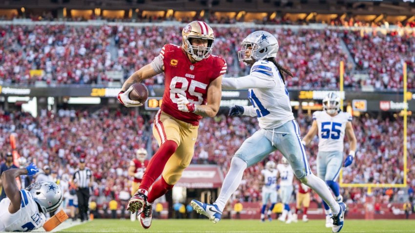 October 8, 2023; Santa Clara, California, USA; San Francisco 49ers tight end George Kittle (85) scores a touchdown against Dallas Cowboys cornerback Jourdan Lewis (2) and cornerback Stephon Gilmore (21) during the second quarter at Levi’s Stadium. Mandatory Credit: Kyle Terada-USA TODAY Sports