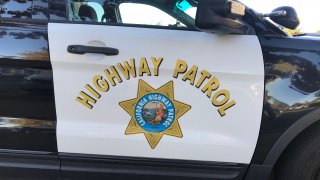 Closeup of CHP - California Highway Patrol car sign and emblem on door of a Ford SUV.
