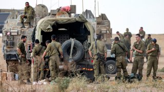 Israeli armuy soldiers deploy at a position near the border with Gaza in southern Israel on October 11, 2023.