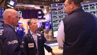 Traders work on the floor of the New York Stock exchange during morning trading on November 10, 2023 in New York City. 