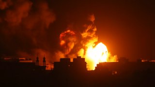 Fire and smoke rises from buildings following Israeli airstrikes on Gaza City