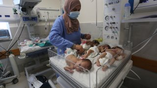 A nurse cares for prematurely born Palestinian babies that were brought from Shifa Hospital in Gaza City to the hospital in Rafah, Gaza Strip.