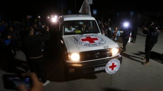 A Red Cross convoy carrying Israeli hostages heads to Egypt from the Gaza Strip in Rafah during a temporary ceasefire between Israel and Hamas on Wednesday, Nov. 29, 2023.