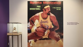 File photo: The Oct. 16, 1972, Sports Illustrated cover and a signed limited edition Wilt Chamberlain sports porcelain figurine on display during the press preview at Sotheby’s Auction House on Aug. 1, 2023, in Los Angeles, California.