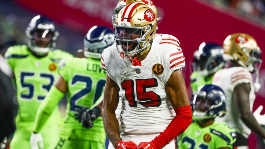 Nov 23, 2023; Seattle, Washington, USA; San Francisco 49ers wide receiver Jauan Jennings (15) reacts after a reception for a first down against the Seattle Seahawks during the first quarter at Lumen Field. Mandatory Credit: Joe Nicholson-USA TODAY Sports