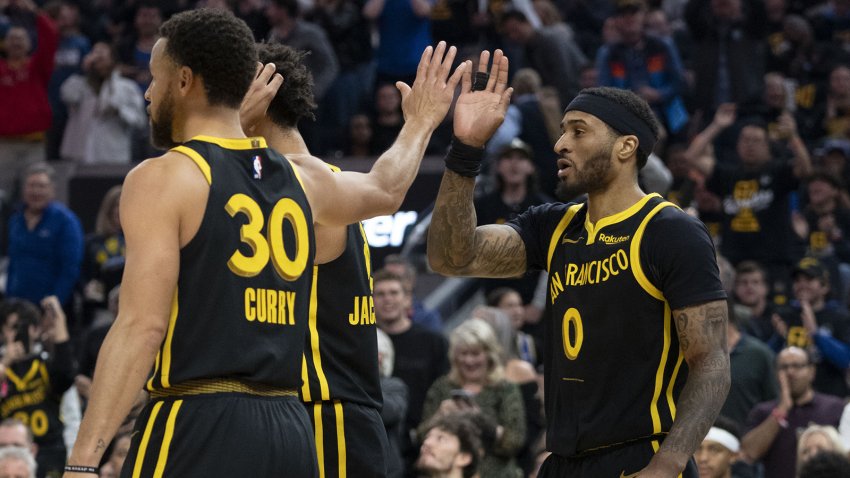 November 24, 2023; San Francisco, California, USA; Golden State Warriors guard Stephen Curry (30) congratulates guard Gary Payton II (0) on a block against the San Antonio Spurs during the second quarter at Chase Center. Mandatory Credit: Kyle Terada-USA TODAY Sports