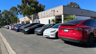 Several Tesla electric vehicles are parked in front of a Tesla service center in the Kearny Mesa region, in San Diego, California, U.S., October 31, 2023. 