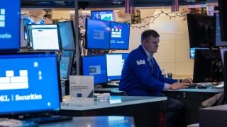 Traders work on the floor of the New York Stock Exchange (NYSE) on the first day back since the Christmas holiday on December 26, 2023 in New York City. 