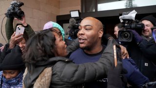 Marvin Haynes, 35, is hugged by a supporter as he walks out of the Minnesota Correctional Facility at Stillwater