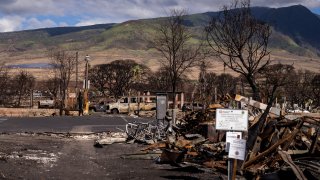 Debris of former shops and businesses on Front Street in burn zone 11A is pictured Friday, Dec. 8, 2023, in Lahaina, Hawaii.